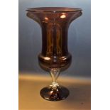 A late 19th century amethyst glass pedestal vase, outswept bucket shaped bowl, clear glass stem, 37.