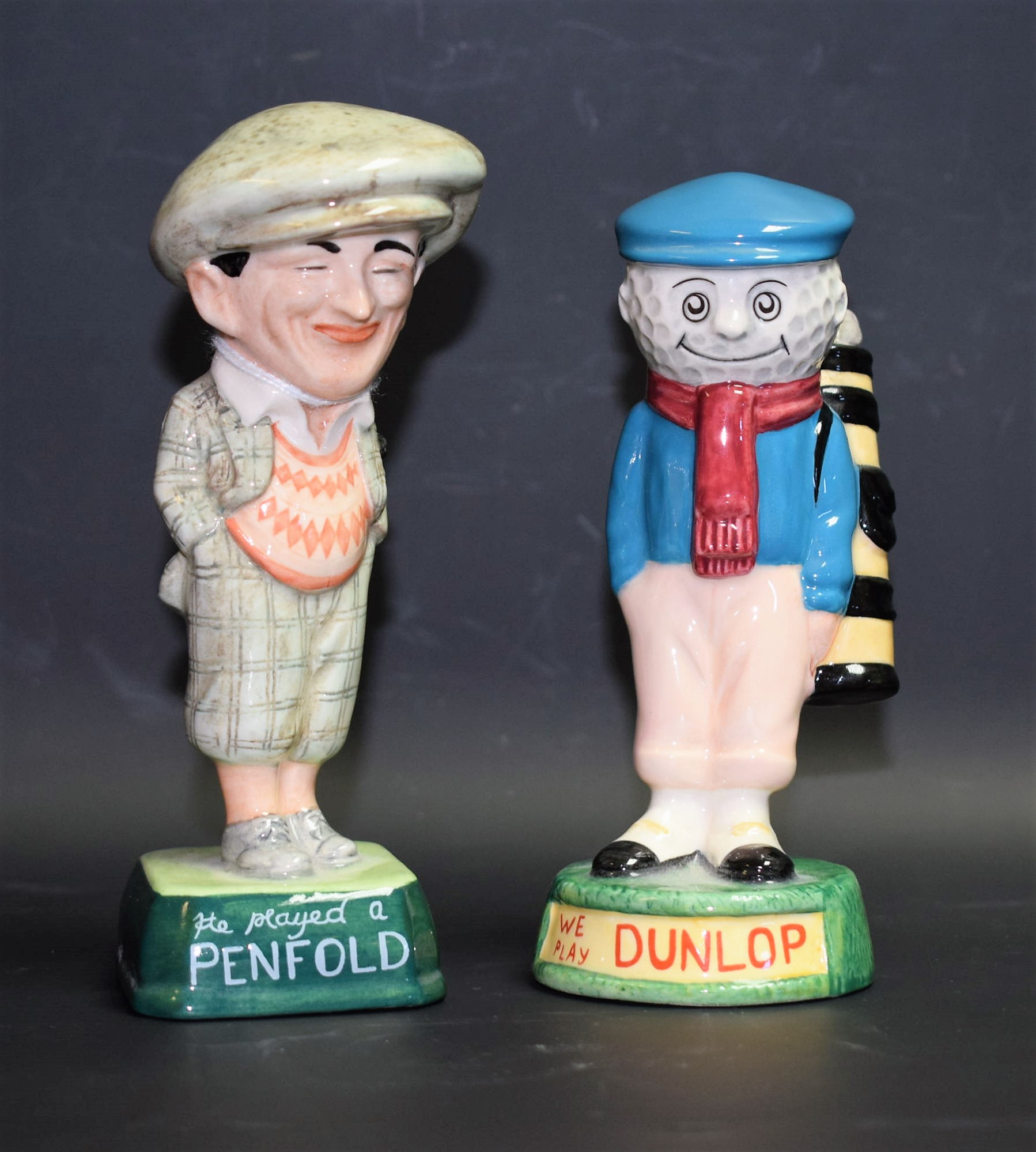 A Royal Doulton ceramic advertising figure, Golfer and Caddie, Dunlop Caddie, MCL2,