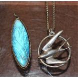 A silver swallow pendant on chain;