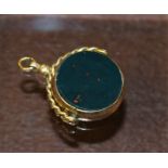 A large 9ct gold bloodstone and carnelian swivel fob