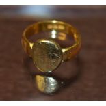 A Victorian 22ct gold and yellow metal signet ring, engraved oval initialled platform, plain shank,