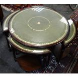 A reproduction circular nested coffee table with leather inlaid top.