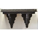 A Jacobean revival carved wall shelf