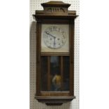 A 1940'S oak wall clock, silvered dial,