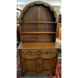 An oak Priory style dome topped dresser,