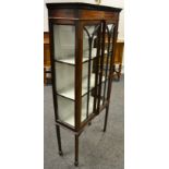 An Edwardian mahogany display cabinet, astragal glazed doors enclosing lined shelving,