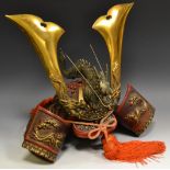 A reproduction Kuwagata Kabute Samurai helmet, surmounted with a dragon,