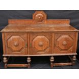 A 20th century oak sideboard, with octagonal panelled doors, c.