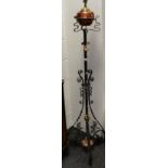 A Victorian wrought iron telescopic standard oil lamp converted to electric.