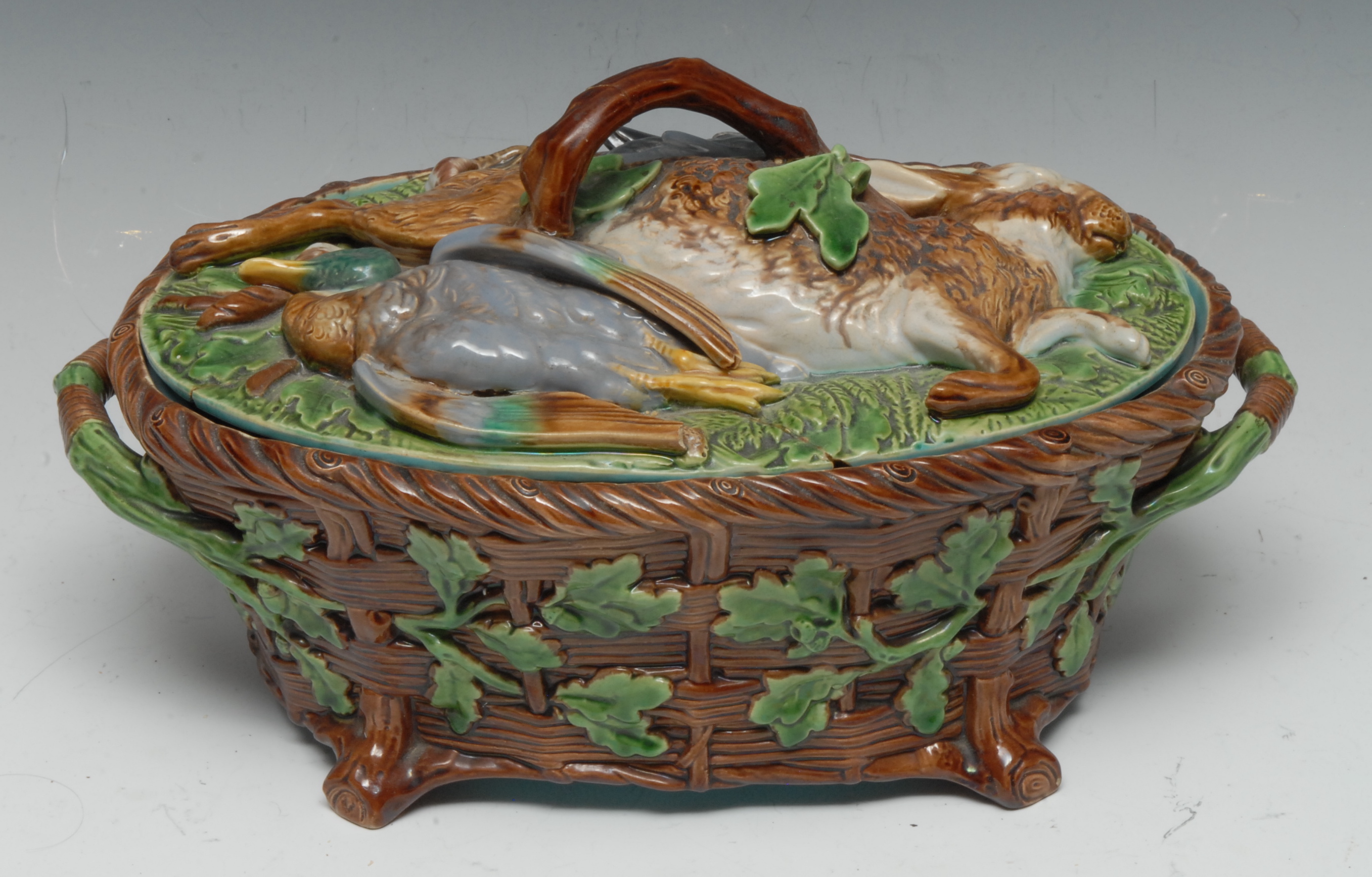 A Minton majolica two-handled game tureen and cover, the cover moulded in relief with hare,