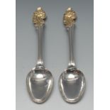 A pair of 18th century Norwegian parcel-gilt silver spoons, Rococo acanthus scroll terminals,