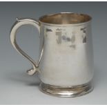 A George II silver bell shaped mug, quite plain, scroll-capped handle, skirted base, 11cm high,