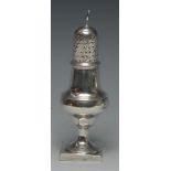 A George III silver pear shaped caster, knop finial, pierced cover engraved with diapers,