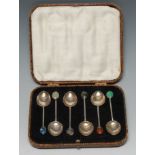 Liberty & Co - a set of six George V silver and hardstone coffee spoons,