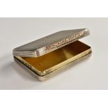 A George V rose gold mounted silver rounded rectangular vesta box, foliate thumbpiece,