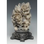 A Chinese soapstone carving, of blossoming peonies, pierced base,