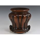 A William IV mahogany wine coaster, carved with stiff acanthus, draught-turned base, 17cm high, c.