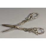 A pair of Regency style silver grape shears, in bold relief with fruiting vine, 16cm long,