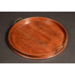 A George III mahogany circular gallery tray, brass carrying handles, 50cm diameter, c.