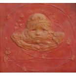 An Art Nouveau square plaque, moulded in high relief and centred by a mask of a putti,