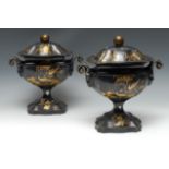 A pair of Regency toleware chestnut vases and covers,