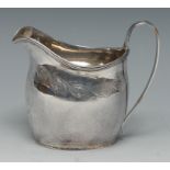 A George III silver boat shaped milk jug,