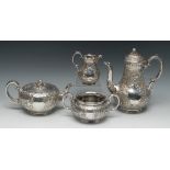 A composed Victorian silver four piece tea and coffee service, comprising teapot, coffee pot,