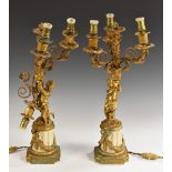 A pair of 19th century French gilt-metal and white marble candelabra,