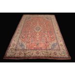 A Mahal carpet, the crimson ground with flowers and foliage in tones of ecru and cerulean,