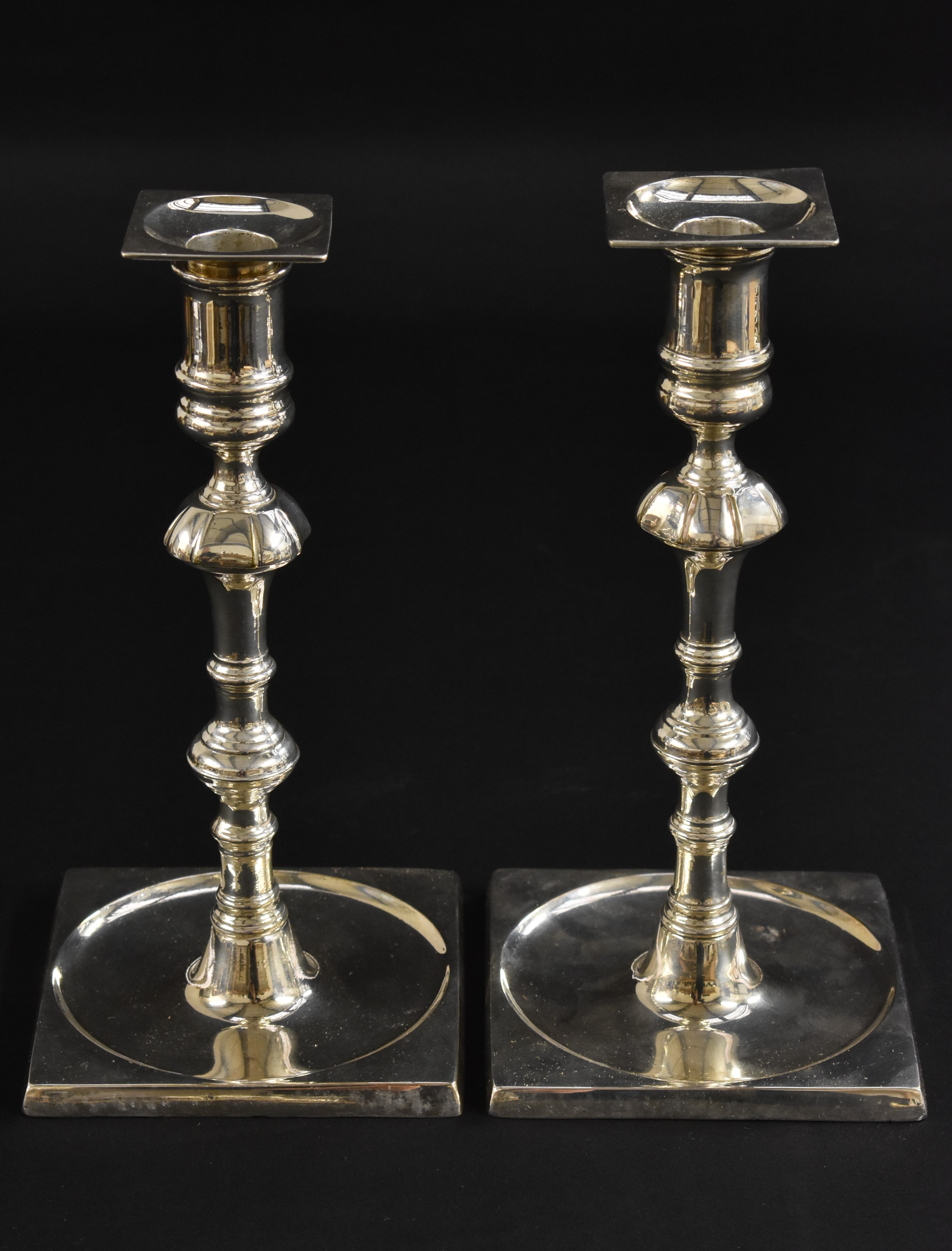 A pair of George II paktong table candlesticks, of seamed construction, detachable nozzles,