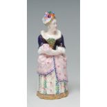 A Minton candle snuffer, Lady Teazle, painted in polychrome, pink skirt, 10.2cm high, c.