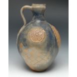 A Roger Guerin (1896-1954) stoneware pitcher, relief decorated with heraldic crests,