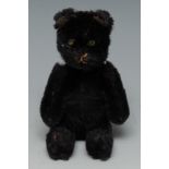 A Schuco cat perfume/scent bottle, black mohair body, green jewelled eyes,