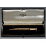 A 9ct gold propelling pencil, by Sampson Mordan and Co, engine turned,