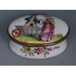 A South Staffordshire enamel oval box, the cover enamelled with lady with barrow, selling plums,