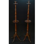 A pair of late 19th century floor standing candlesticks,