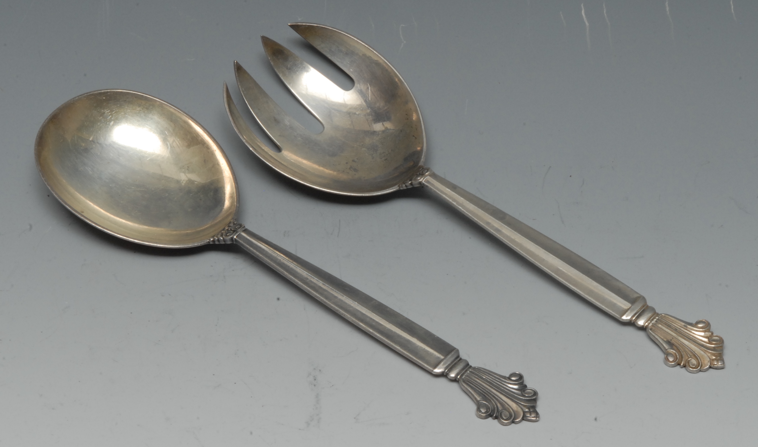 Georg Jensen - a pair of Danish silver Acanthus or Dronning pattern salad servers,