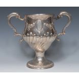 A George III silver pedestal presentation loving cup, half-fluted and chased with flowering swags,