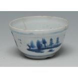 A Lowestoft circular tea bowl, painted in underglaze blue with a stylized Chinese river landscape,