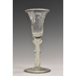 A George III opaque twist wine glass, the bell shaped bowl engraved with fruiting vine,