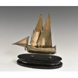 A Maltese silver model, of a sailing yacht, ebonised oval plinth, 917 standard, 16.
