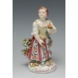 A Bow figure of a girl, holding a flowers and spatula, in colours, 17cm high, c.