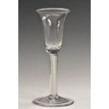 A George III opaque twist wine glass, bell shaped bowl, double-helix stem, spreading foot,