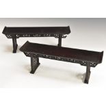 A pair of Chinese hardwood miniature altar tables, pierced and carved aprons and end supports, 35.