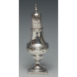 A George III silver pear shaped caster, knop finial, pierced cover engraved with diapers,