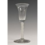 A George III opaque twist wine glass, bell shaped bowl, double-helix stem, spreading foot, 15.