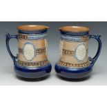 A pair of late Victorian Doulton Lambeth salt glazed stoneware cylindrical jug,