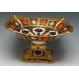 A Royal Crown Derby 1128 pattern pedestal shaped square comport, in relief with dolphins to angles,