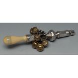 A George III silver child's rattle, with whistle and seven bells, turned ivory handle, 15cm long, c.