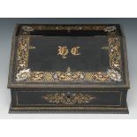 A 19th century French brass mounted ebony and Boulle-type marquetry slope-front table box,